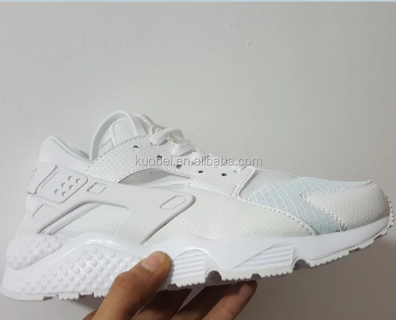 white color sports shoes