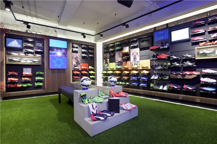 Free Design Sports Display Rack Men Sports Shoes Shop Interior Design Display Wall Shelf