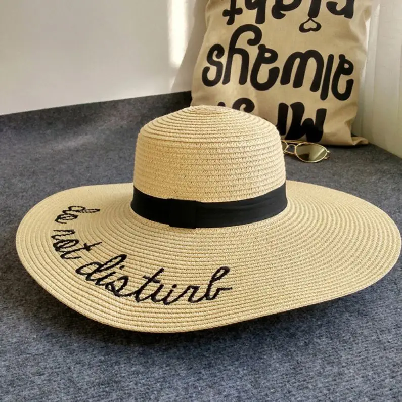 sun hat with writing on brim