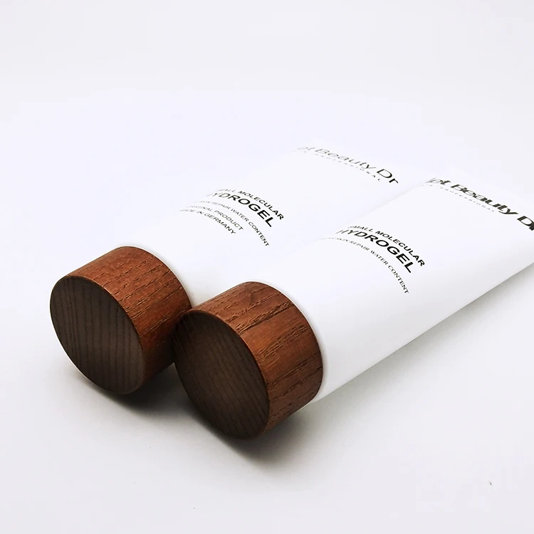 Plastic white cosmetic cream PE packaging tube with wood cap 200ml
