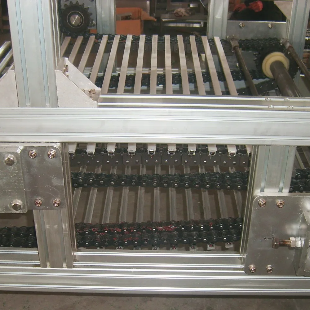 C Configuration Continuous Vertical Lift Conveyor with Adjustable Speed Stainless Steel Belt Material