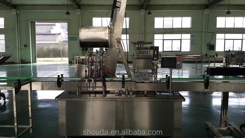 
Машина для розлива и закупорки стеклянных бутылок 