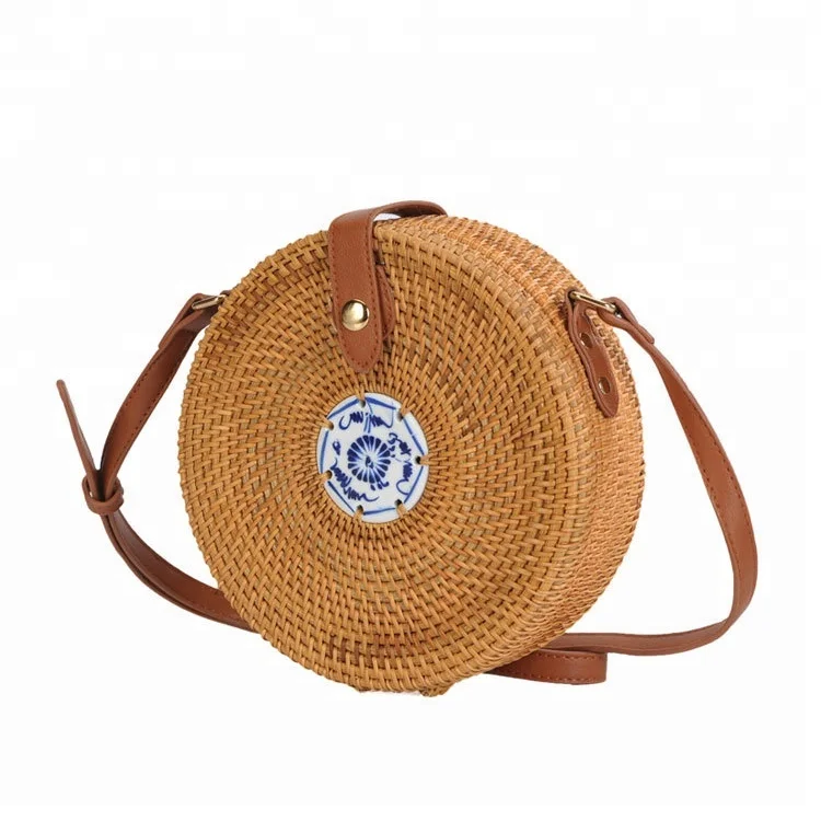 Threadbare straw curved cross-body bag in natural | ASOS