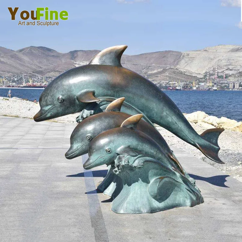 Diver with Dolphin Bronze Statue - Size: 10L x 30W x 49H.