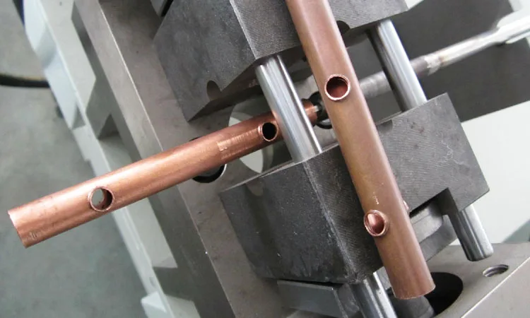 BOBO Machine automatic metal copper pipe hole punching and flanging shown in a detail photo for this news article