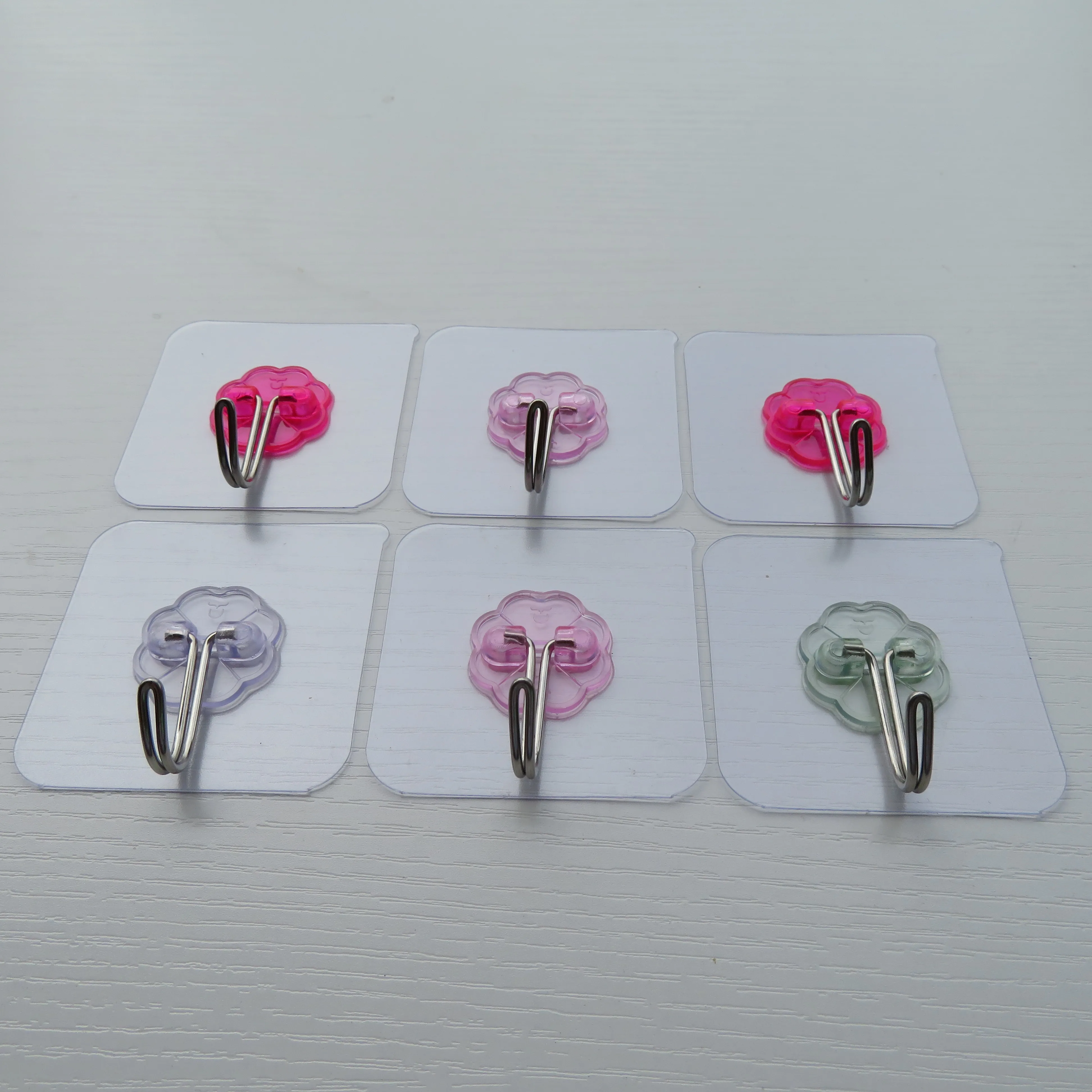 Can process and customize a variety of color plum pieces of metal traceless novelty hooks factory direct sales supplier