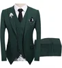 Top, pantaloni e gilet verde scuro