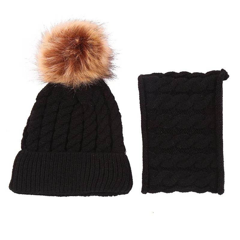 black bobble hat with brown bobble