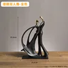 Waist-hugging pas de deux (gold)