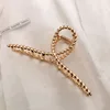 6 twist cross-kc gold