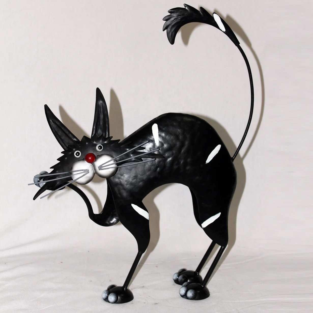 Cartoon-style Metal Cat red nose extravagant act