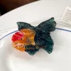 Dark green goldfish