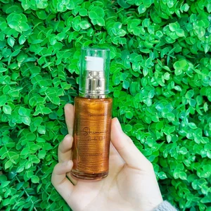 Private Label Organic Vegan Shiny Oil Glow Liquid Illuminator Makeup Shimmer Body Oil Shimmering Oil