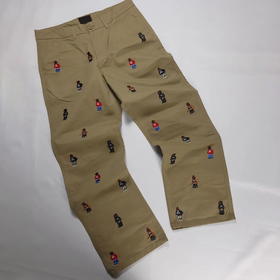 Wysokiej jakości nowe projektowe spodnie robocze z 3D haftowanymi motywami kreskówkowymi, luźne, proste nogawki, streetwear, chino dla mężczyzn, OEM, 100% bawełna