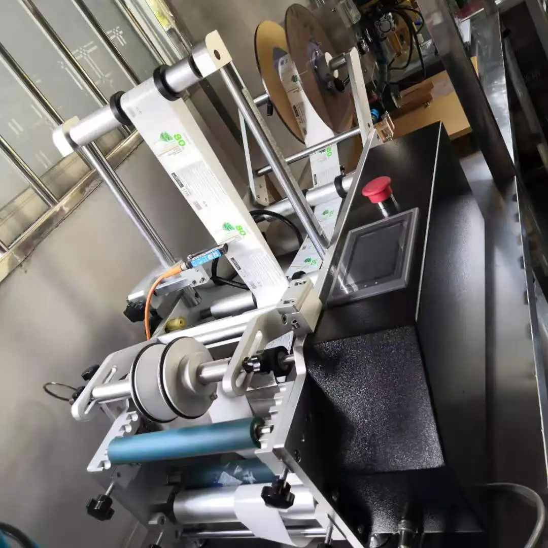 
Настольные полуавтоматические этикетировочные машины для круглых бутылок, банок, банок 