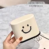 boîte à cure-dents avec visage souriant