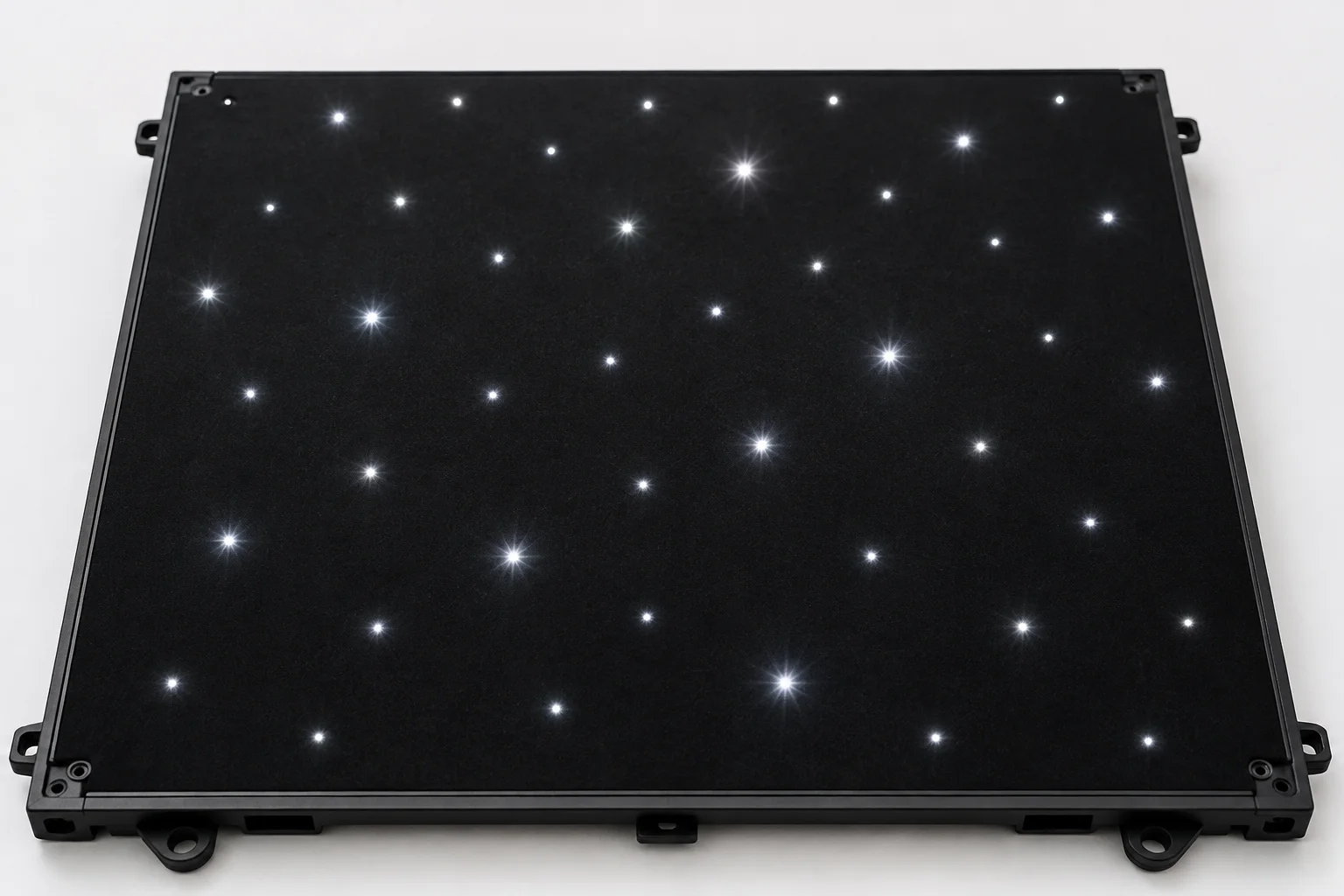 Close-up of star LED dance floor tile showing individual LED points illuminated against black background creating twinkling star effect