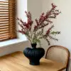 Black boutonniere vase with red golden willow branch
