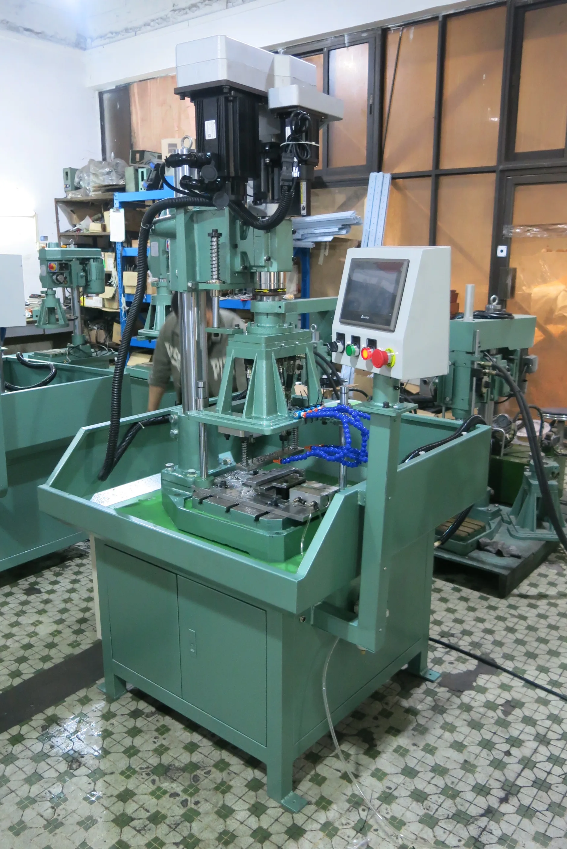BOBO Machine fully automatic vertical drilling machine hex nuts and shown in a detail photo for this news article