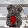 thin grey bear with red heart with box