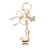 Porte-clés petit papillon doré-J