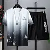Ensemble haut et short à motif éclaboussures d'encre blanche.
