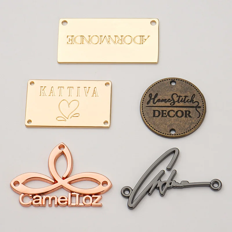 Design Brand Logo Engraved Metal Label Tag Gold Bag Garment Sewing Hole Logo Metal Clothing Label Custom Metal Tags for Swimwear