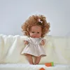 Grey pink dress with brown skin and blonde hair
