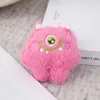 Delicato peluche rosa a forma di mostro con grandi occhi, tre generazioni, 10 cm