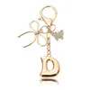 Porte-clés petit papillon doré-D