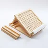 Almohadilla engrosada de madera de pino (punto de ocho posiciones) en tono púrpura.
