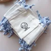 White Bag with Blue Ribbon