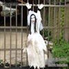 The ghost bride is suspended by an iron chain