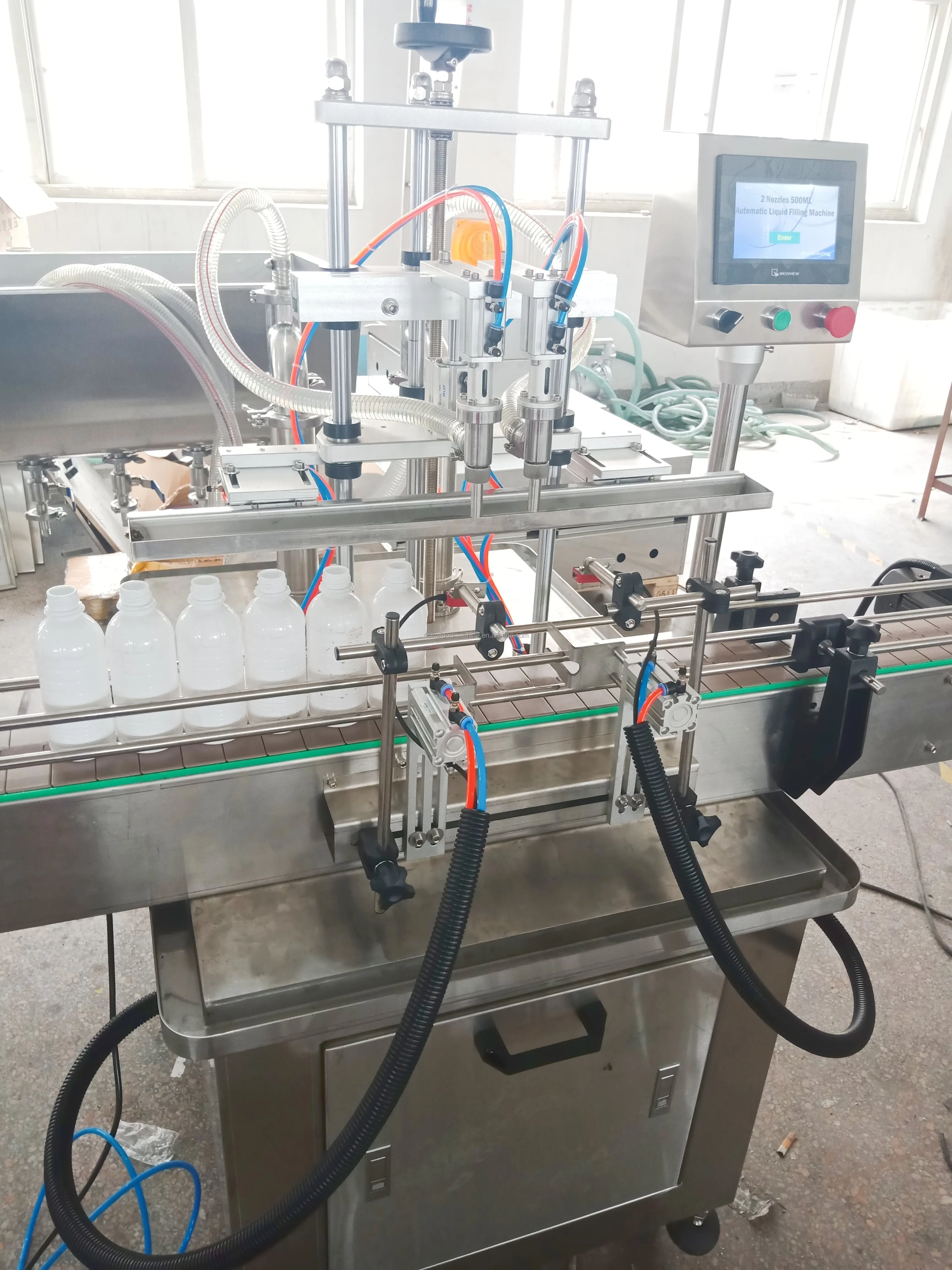 Good Selling 4 Heads Automatic Vacuum Liquid Filling Machine 50 Bpm