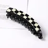 6 black-and-white checkered banana clips