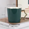 Dark green gold-plated star handle
