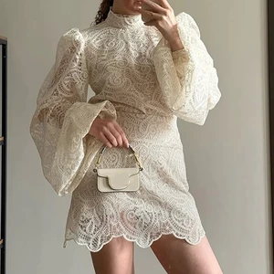 2026 New Fashion White Lace Dresses Club Evening Party Robes Elegant Solid Flared Sleeve High Neck Slim Pleat Mini Women Dress