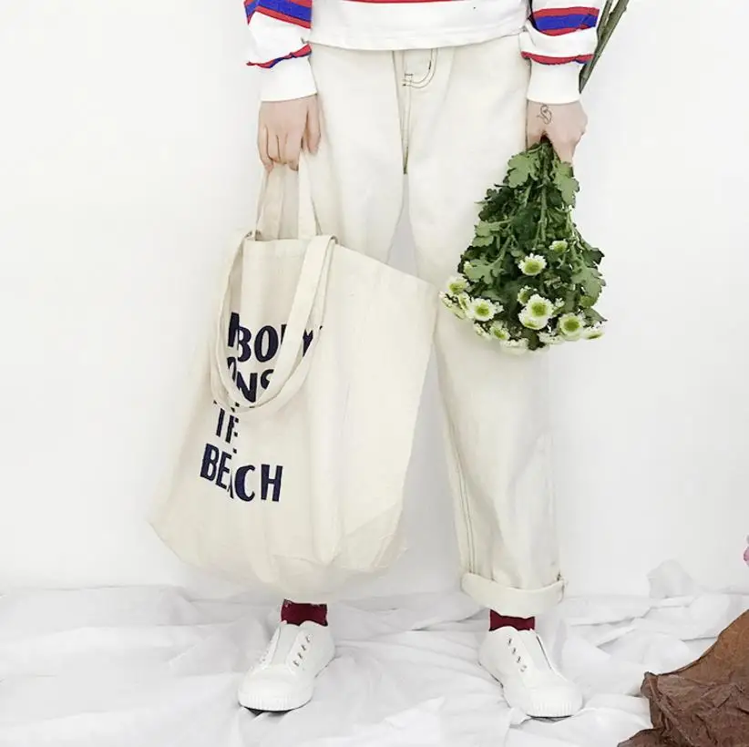 Nobody Owns The Beach Wide Canvas Tote Bag