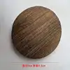 Posavasos redondo de una sola pieza, fabricado en madera de paulownia quemada.