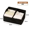 Black compartmentalized storage box