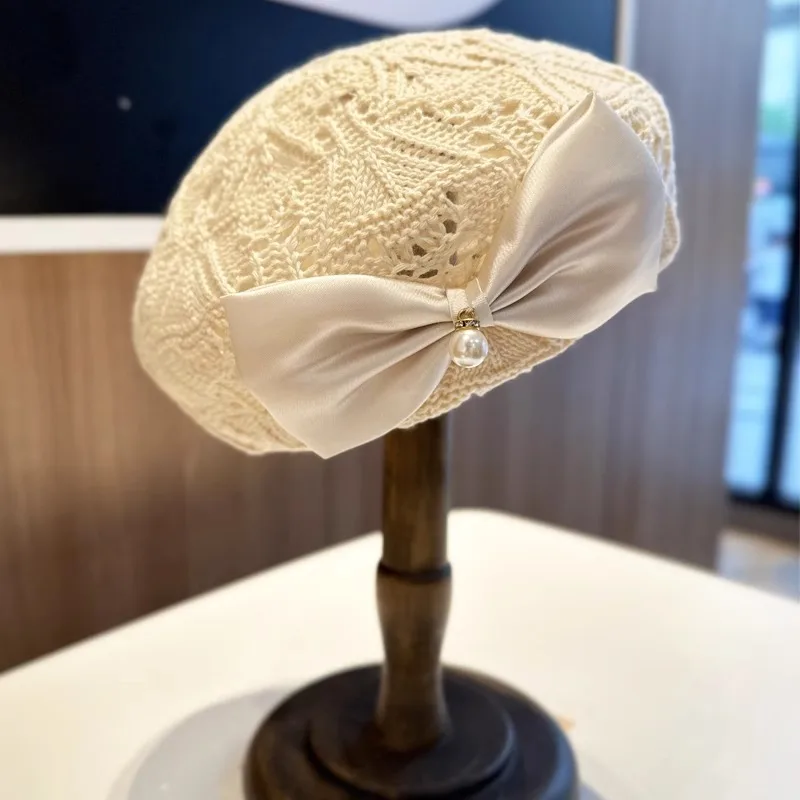Women Trendy Bow Pearl Woven Beret Hat Summer Hollow Out Hat  display picture 1
