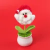 Red Santa Claus head potted plant