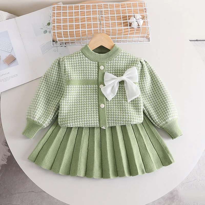 2023 Girls Designer New Solid Sweater Plaid Pleated Skirt Autumn Winter Bow Knitting Two Pieces Long Bubble Sleeves Kids Wear