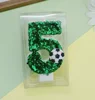 Candela numero 5 a forma di pallone da calcio