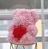 fat pink bear with red heart with box