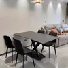 Una mesa y cuatro sillas de 120*70*75 cm.