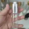 Clear bottle with silver tops