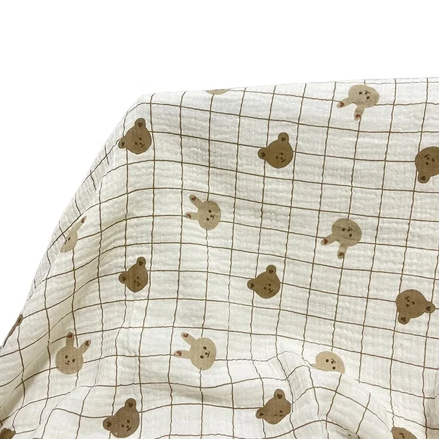 Wholesale ready-made inventory cartoon pattern 100% cotton wrinkle printing double layer gauze swaddling blanket pajama fabric
