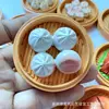 - Steamed buns in a steamer