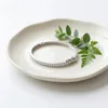 Chapado en oro blanco con circonita cúbica